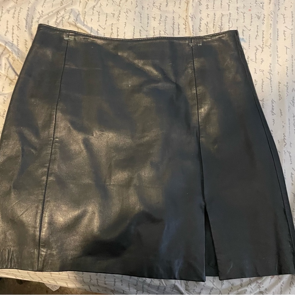 black leather skirt with small side slit